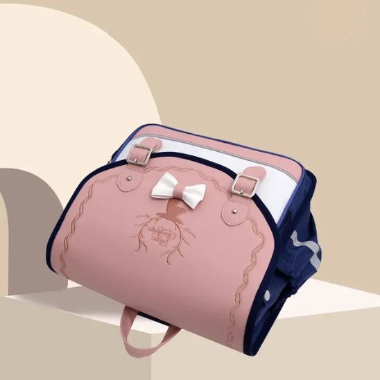 cartable-sac-a-dos-en-nylon-bleu-et-rose-incline